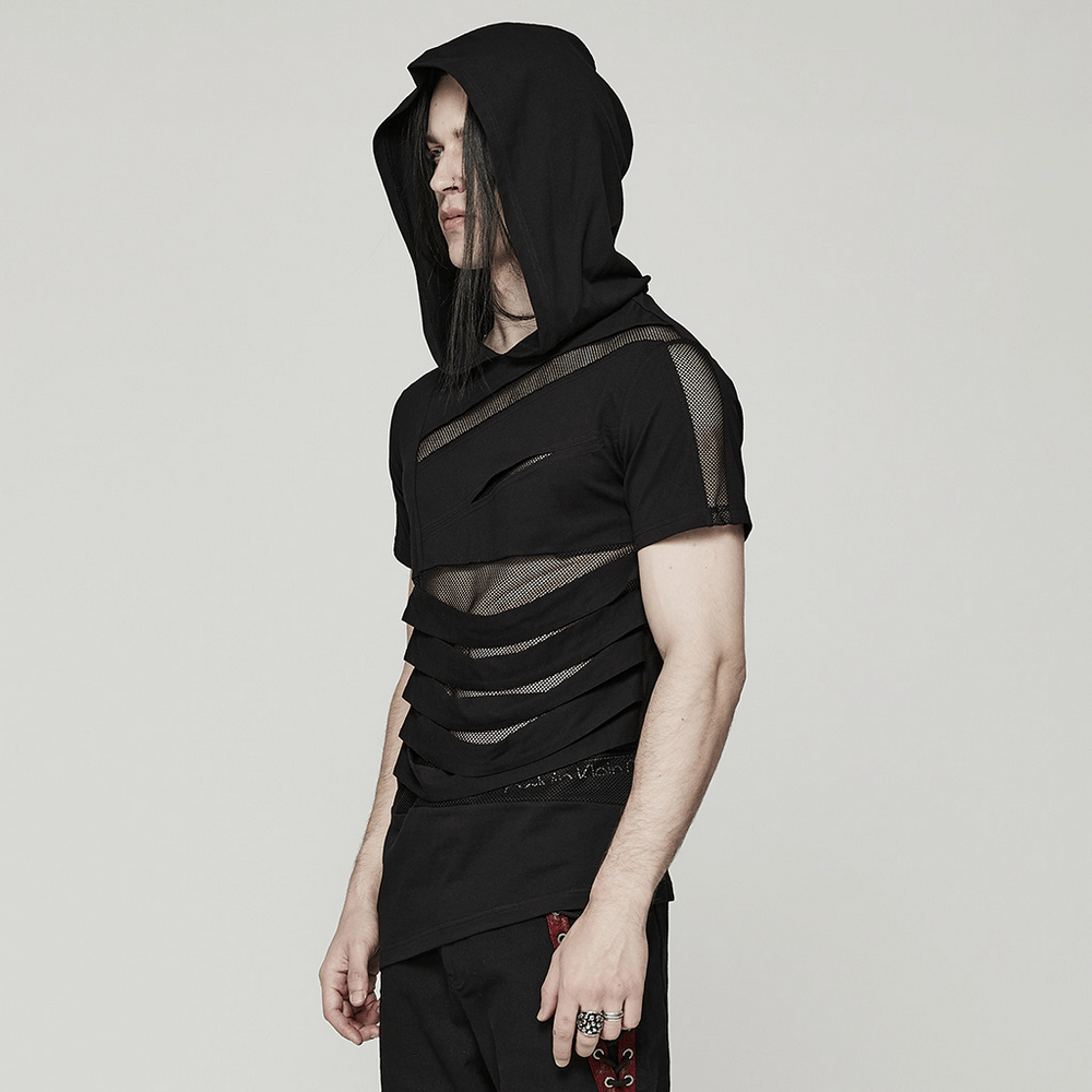 Man wearing a stylish black mesh spliced punk hooded t-shirt, showcasing its edgy design and rebellious vibe.