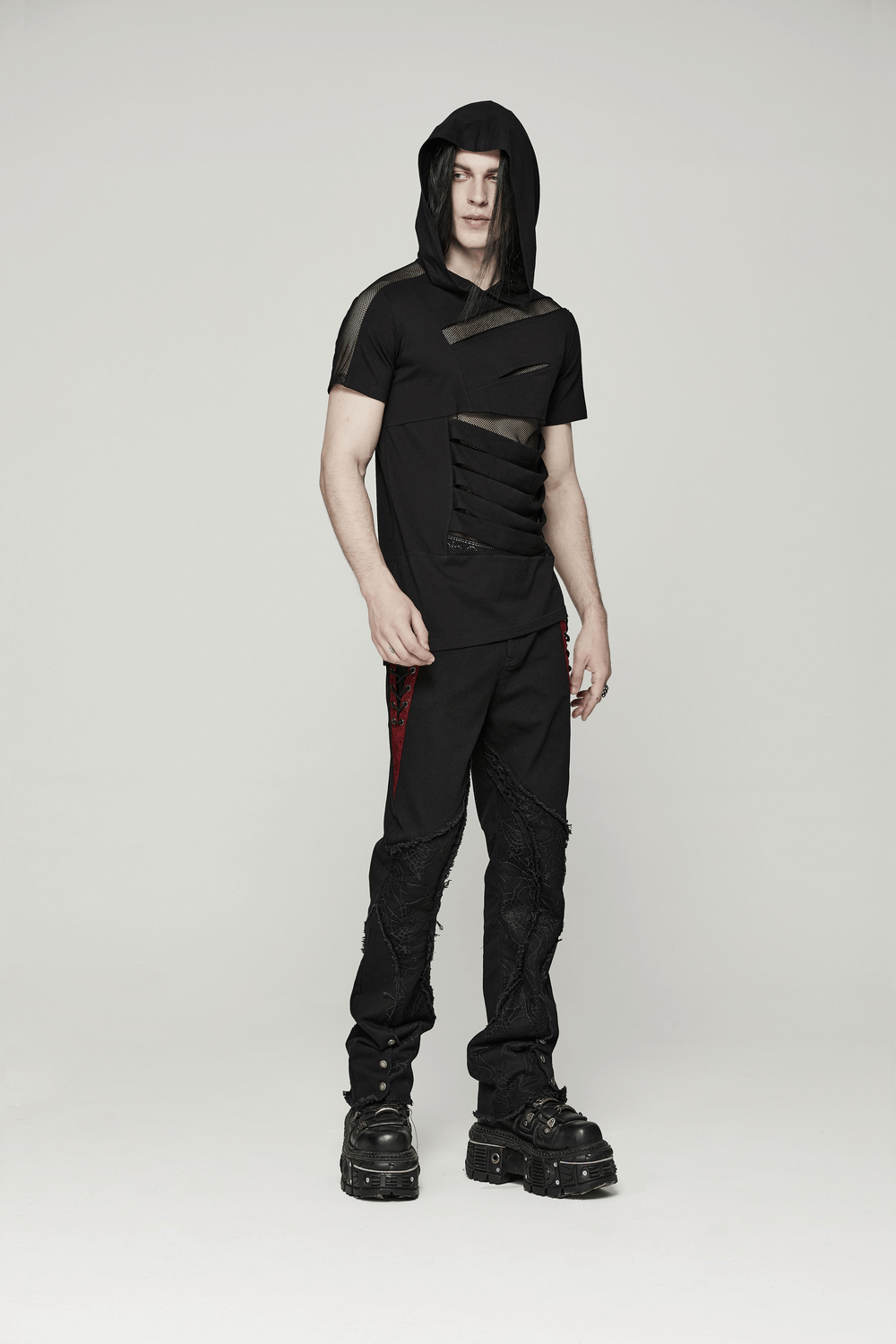 Stylish black punk hooded t-shirt with mesh splicing, paired with edgy black pants and chunky boots.