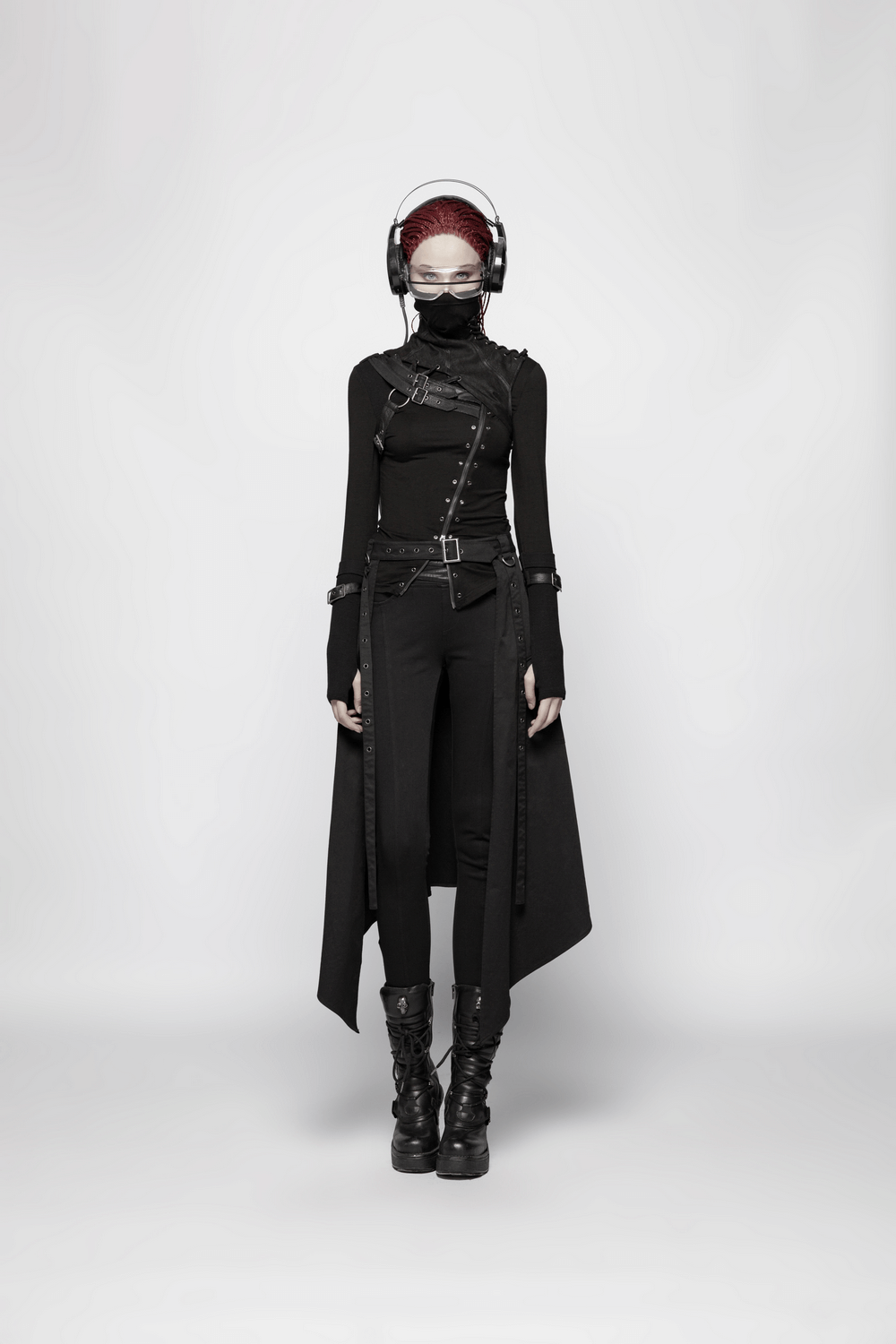 Edgy model in a black punk turtleneck, sleek pants, and oversized headphones, showcasing a bold fashion statement.