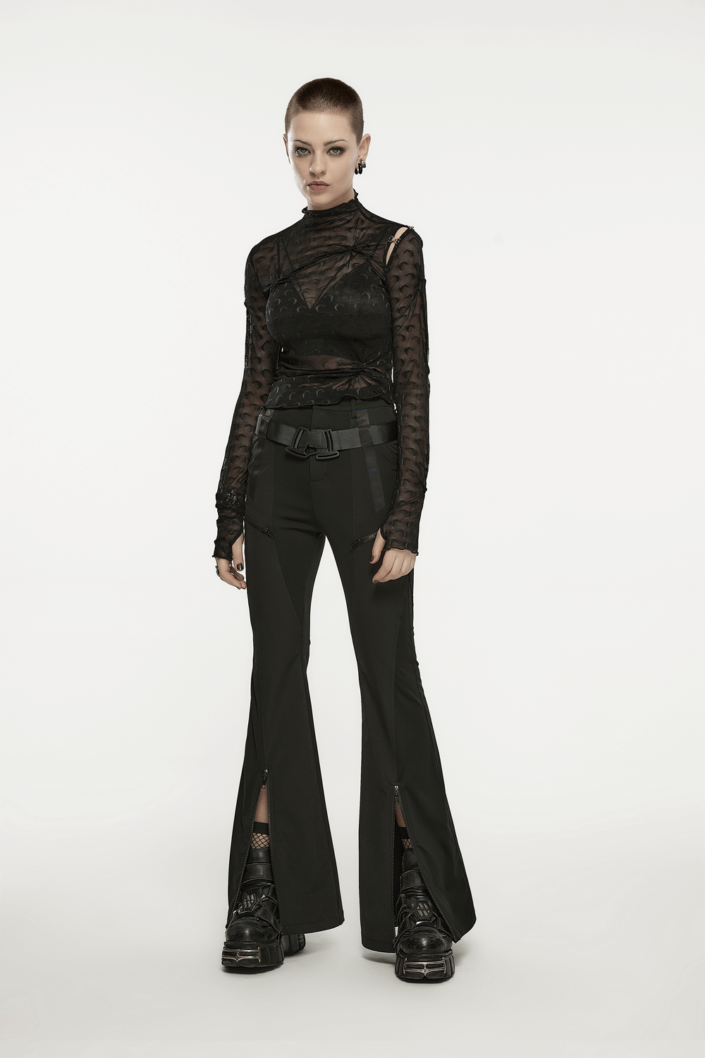 Model showcasing stylish black punk tech flared cargo pants with a trendy top and techwear accessories.