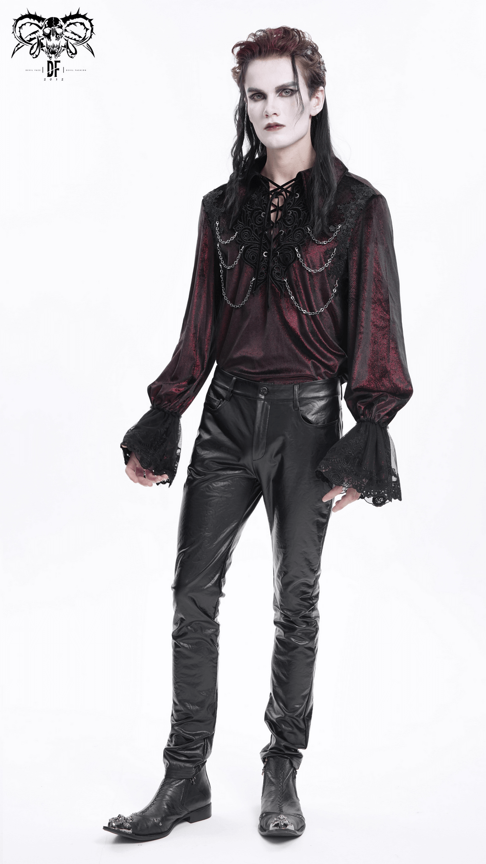 Male model in stylish black slim fit leather trousers and a dark, ornate shirt, exuding a gothic vibe.