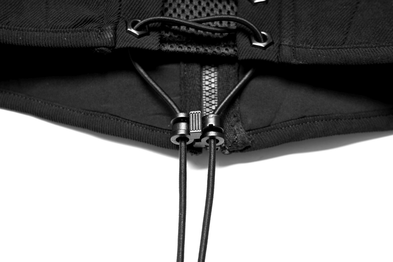 Close-up of a stylish black waistband with sleek laced-up design and modern adjustable buckles for a refined look.