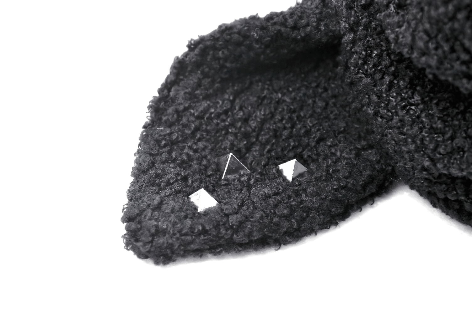 Close-up of the stylish crop hoodie with dog ears and silver spikes, showcasing its unique texture and edgy design.