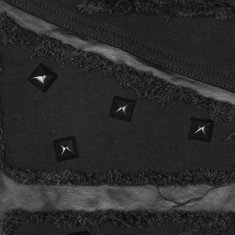 Close-up of distressed denim with metallic studs, showcasing punk style and edgy fashion details.