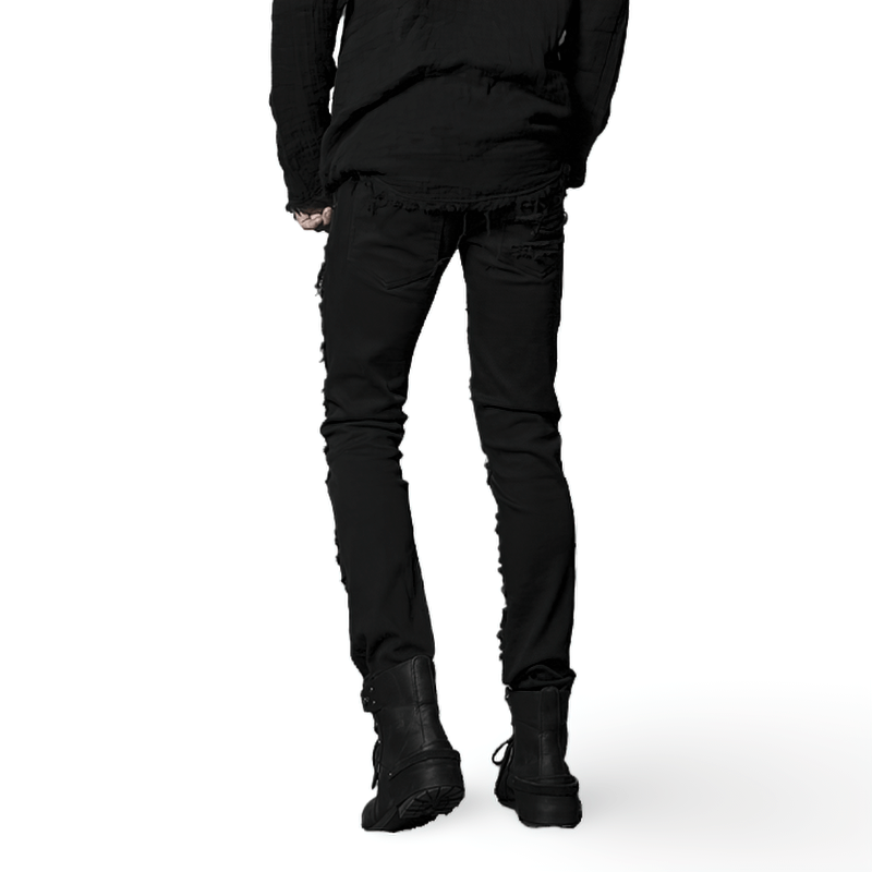 Edgy black distressed knee-patch punk trousers showcased from the back with urban styling and stylish boots.