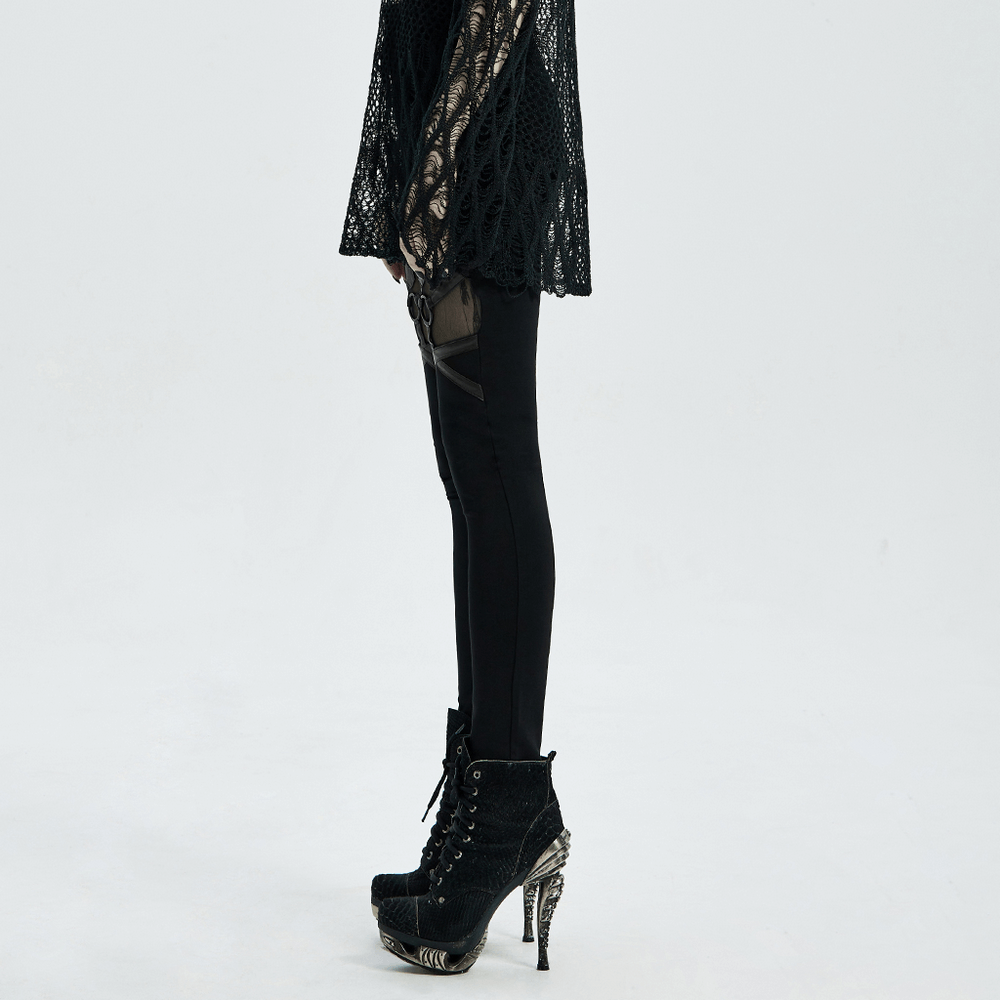Gothic-inspired black mesh-paneled leggings paired with stylish high-heeled boots, showcasing edgy fashion design.