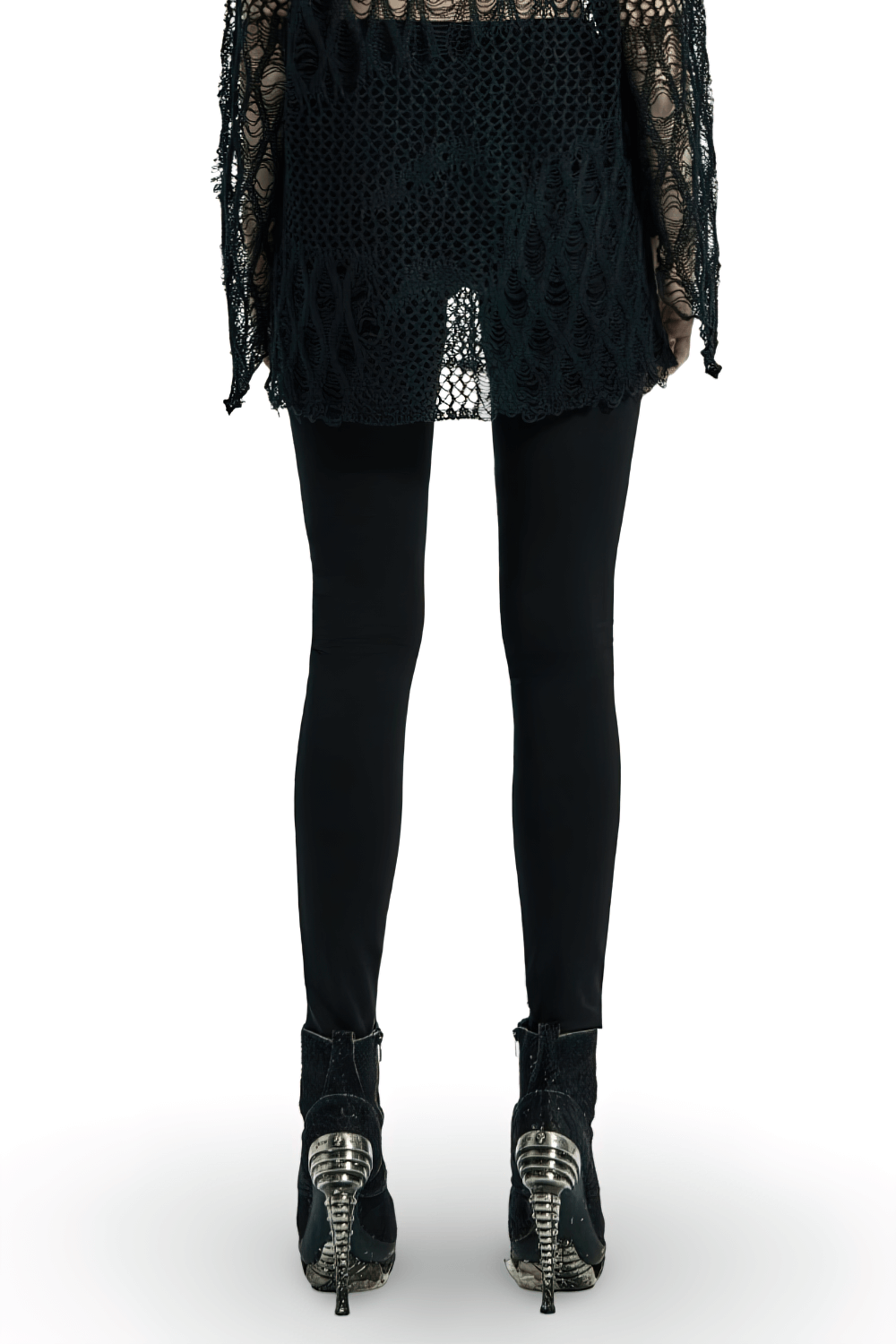 Back view of stylish women's leggings with mesh panels, paired with edgy lace top and unique high-heeled shoes.