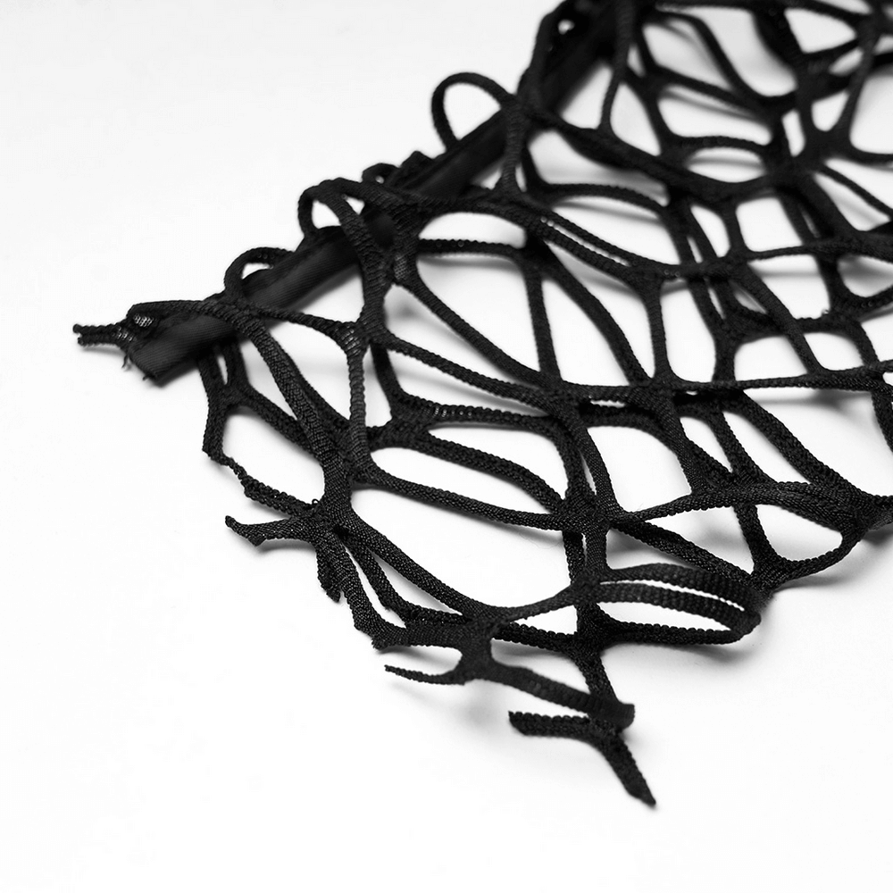 Close-up of edgy black sheer mesh fabric, perfect for punk-style oversized knit tops.