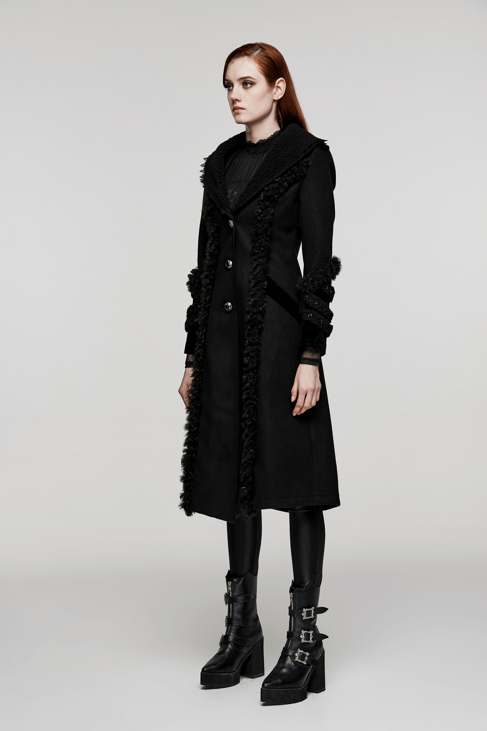 Model showcasing a stylish gothic plush-striped coat with jacquard trim, perfect for bold fashion statements.