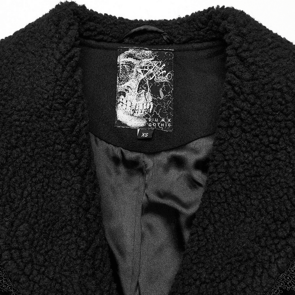 Interior of a stylish gothic coat featuring skull label and plush fabric lining, perfect for edgy fashion enthusiasts.