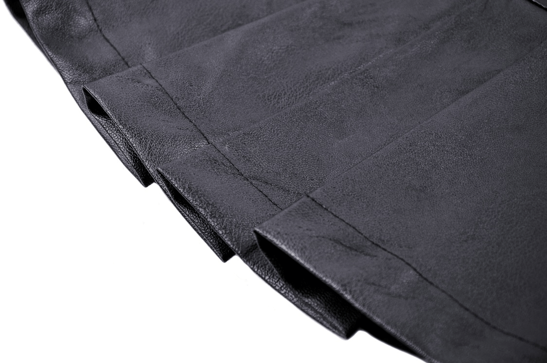 Close-up of edgy pleated black faux leather mini skirt showcasing the stylish buckle detail.