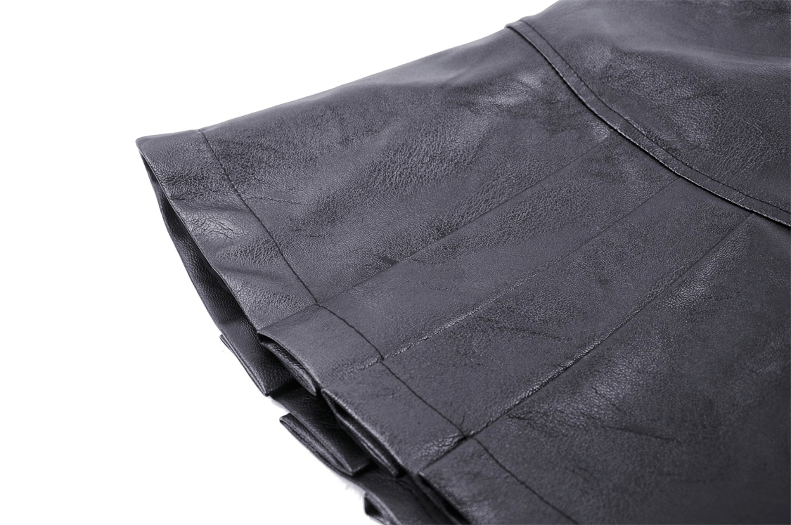 Close-up of stylish faux leather pleated mini skirt showcasing edgy pleats and metal buckle detail.