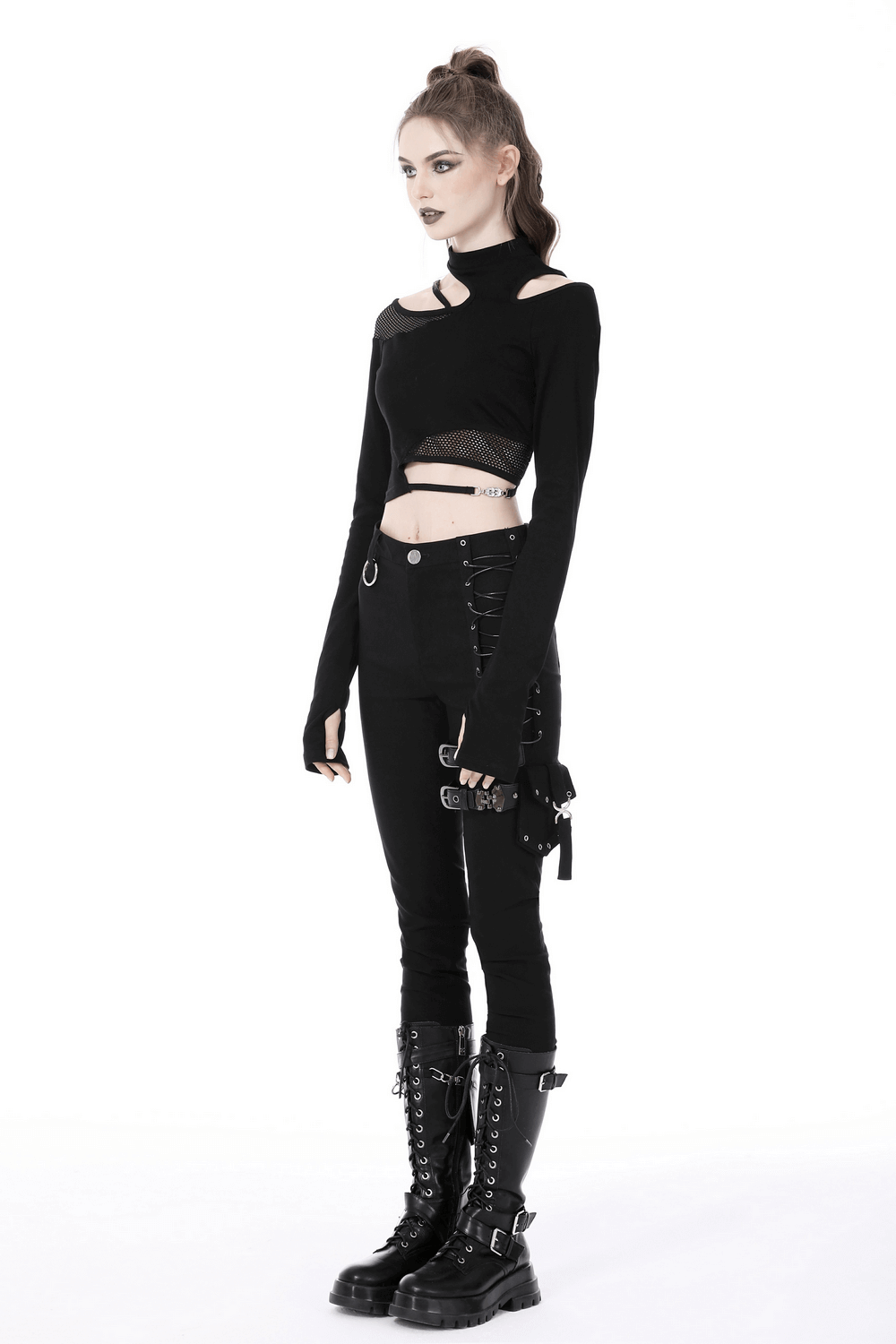 Stylish female in black off-the-shoulder punk top with long sleeves and edgy details, paired with combat boots.