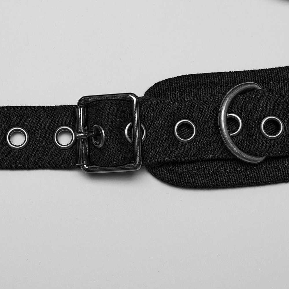 Close-up of stylish black micro twill O-ring chest harness with punk-inspired adjustable straps and metal details.