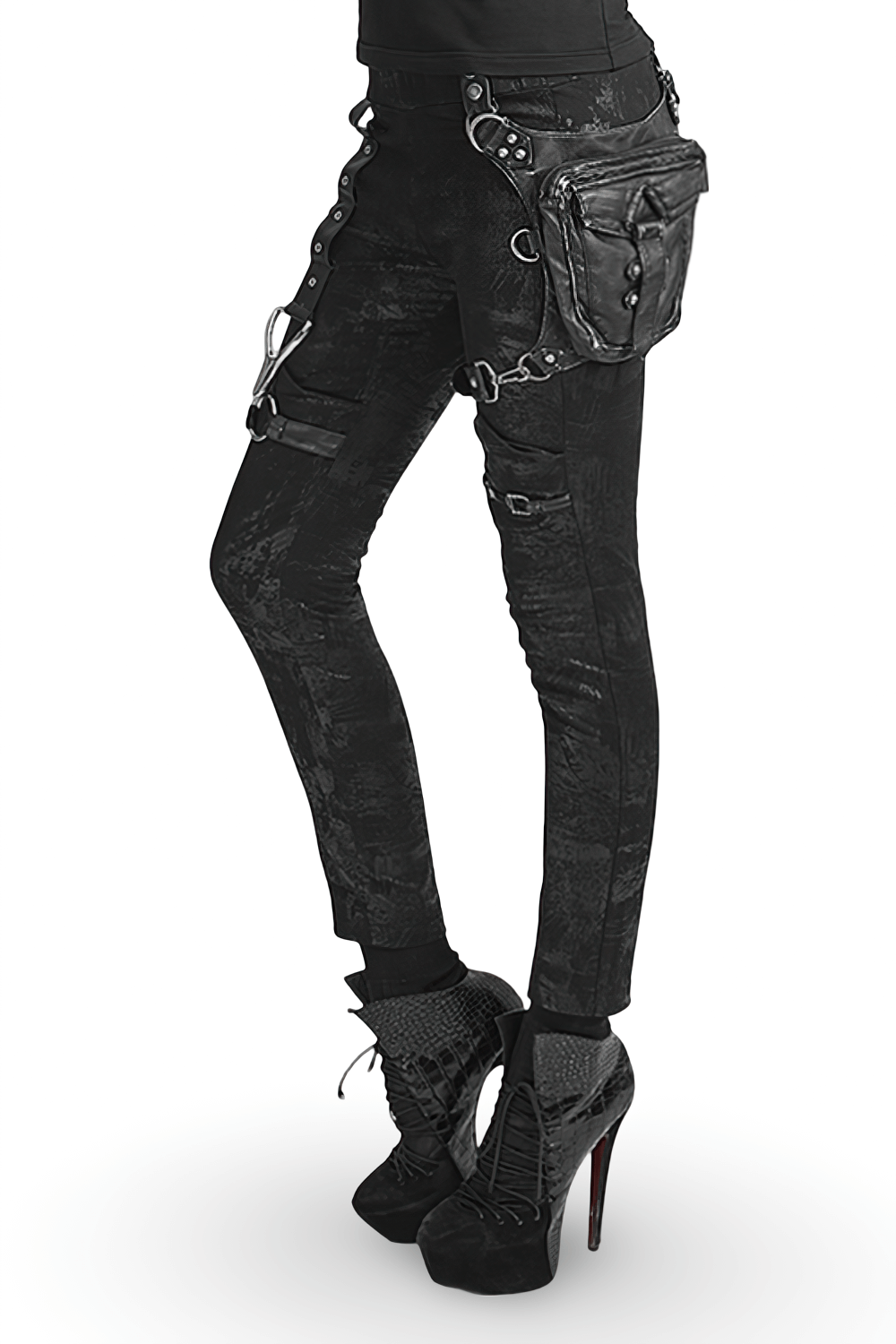 Stylish female model in black punk pants with a waist bag and high heels, showcasing a gothic fashion look.