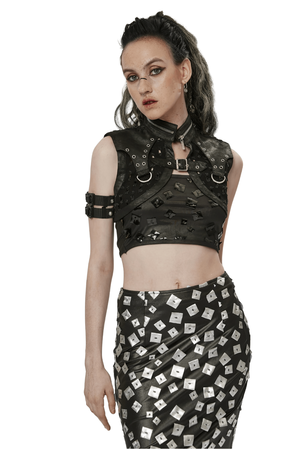 Stylish female modeling a black studded waistcoat and edgy skirt, showcasing punk gothic fashion.