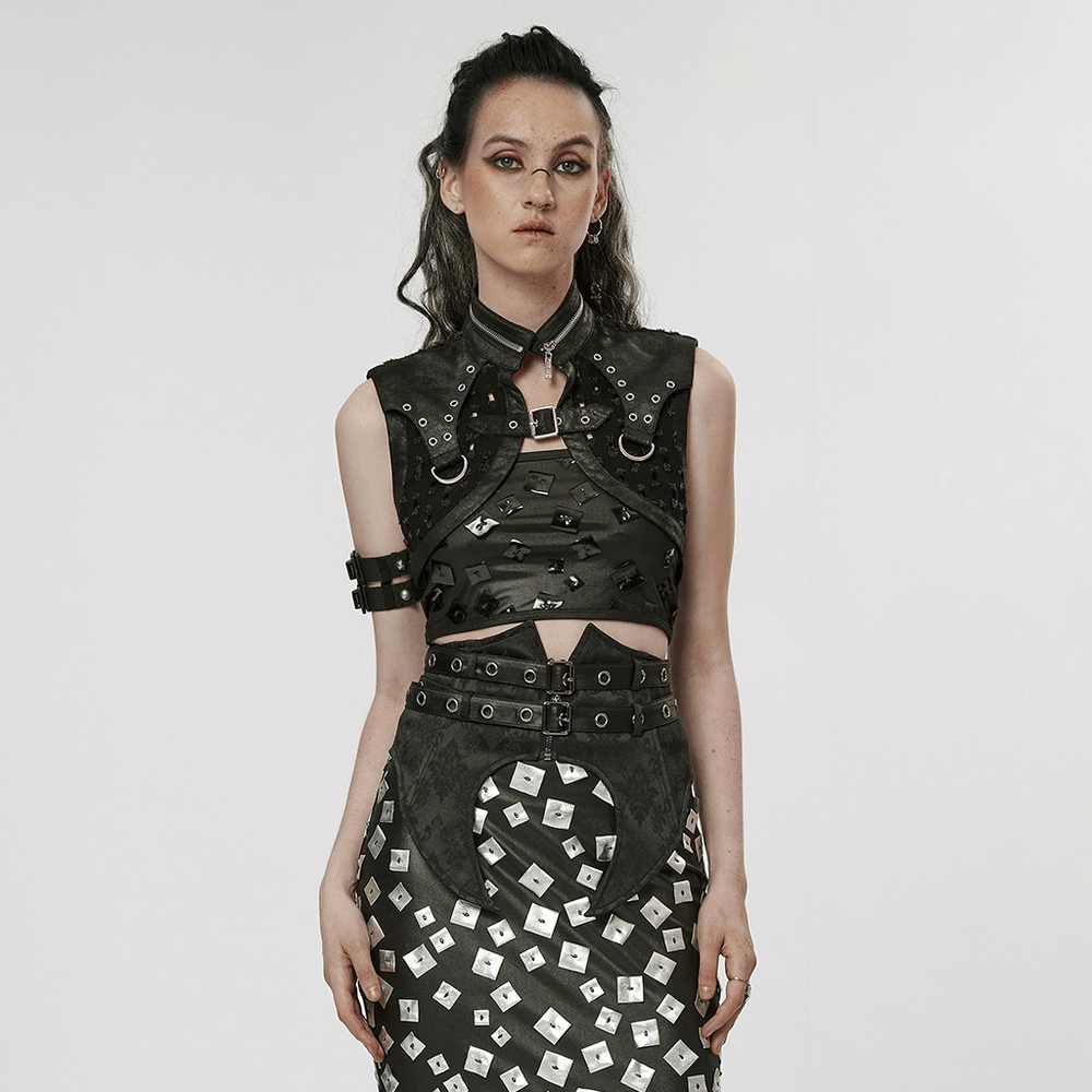 Stylish female model wearing a gothic black studded waistcoat and edgy skirt, showcasing punk fashion.