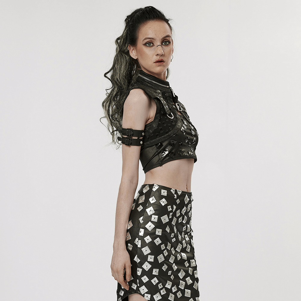 Stylish female in a punk black studded waistcoat and metallic skirt, showcasing edgy gothic fashion.