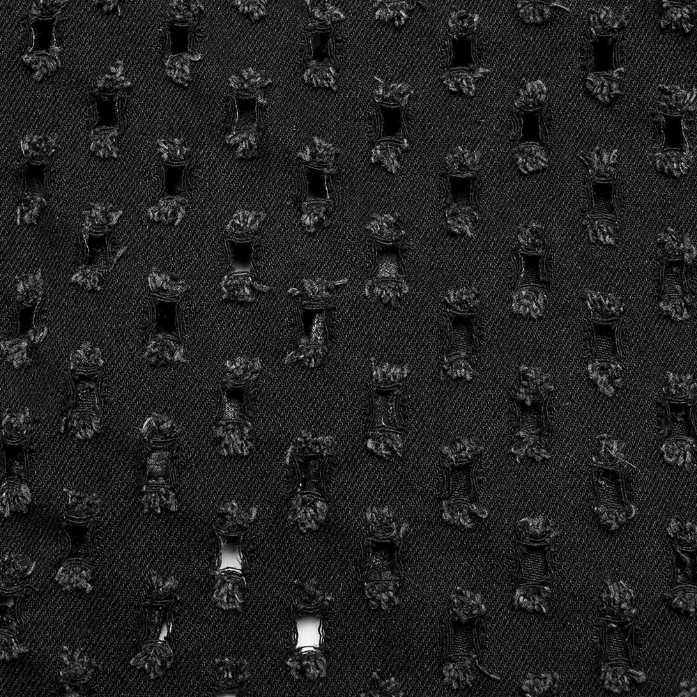 Close-up of black ripped twill fabric with studded details, perfect for gothic punk fashion.