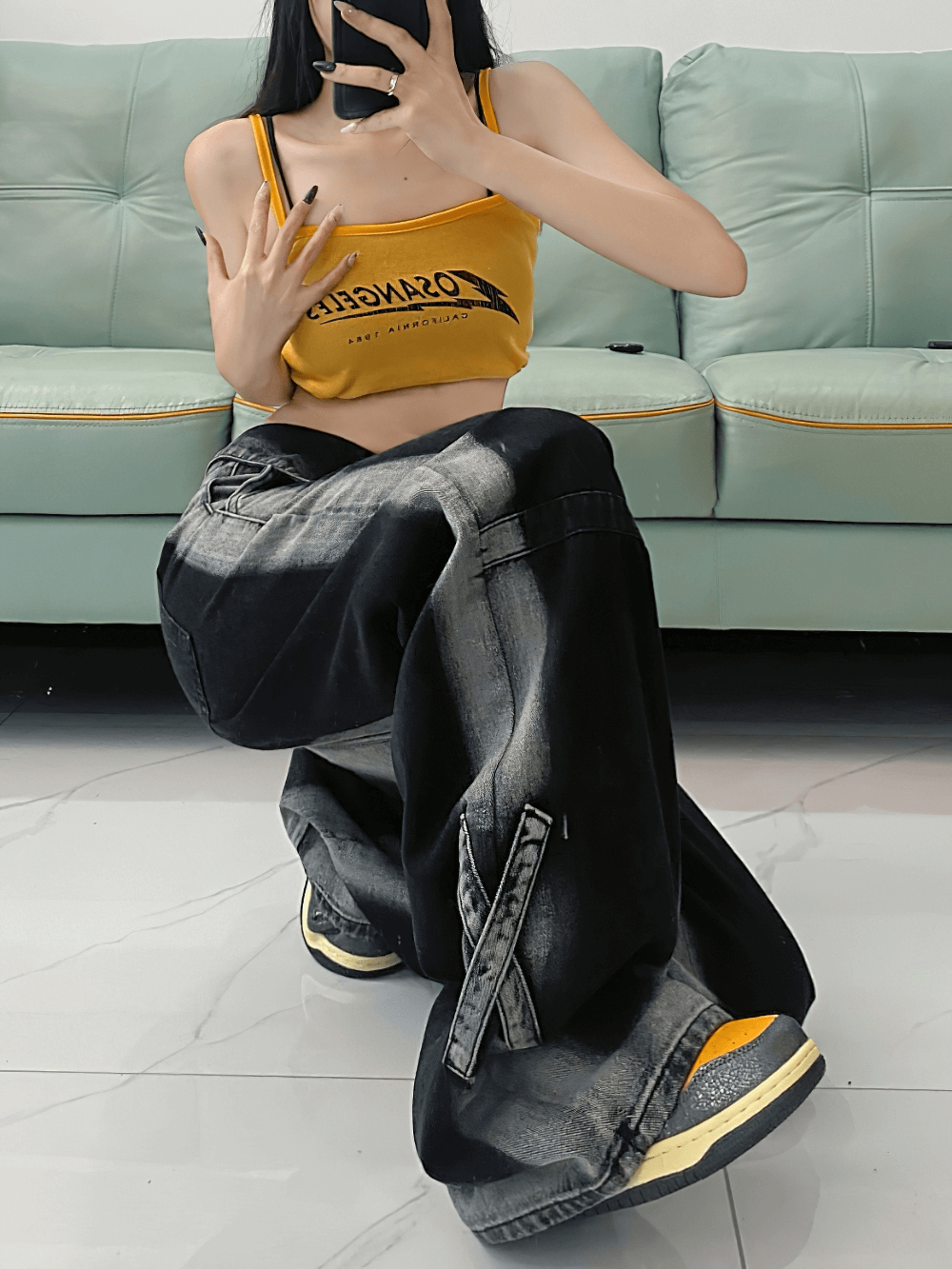 Stylish female wearing high waist straight denim pants paired with a trendy yellow crop top, showcasing alternative fashion.