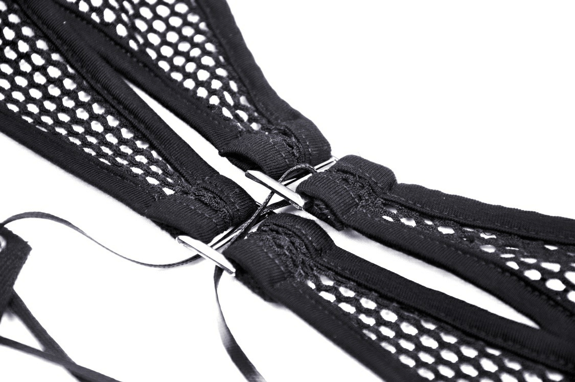 Close-up of lace-up detailing on a stylish black mesh top, showcasing a dramatic gothic design.