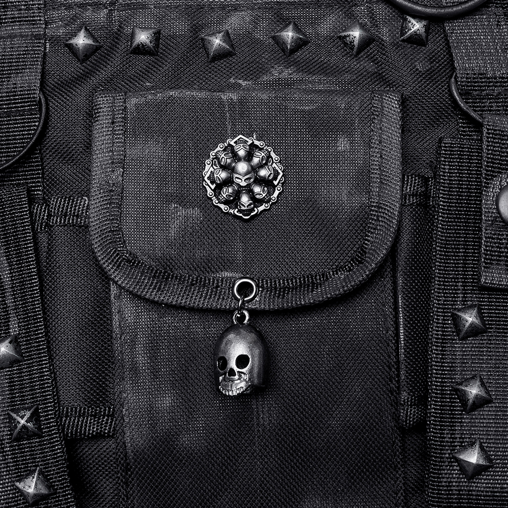 Close-up of punk bag featuring black studs, skull charm, and detailed decorative pocket.