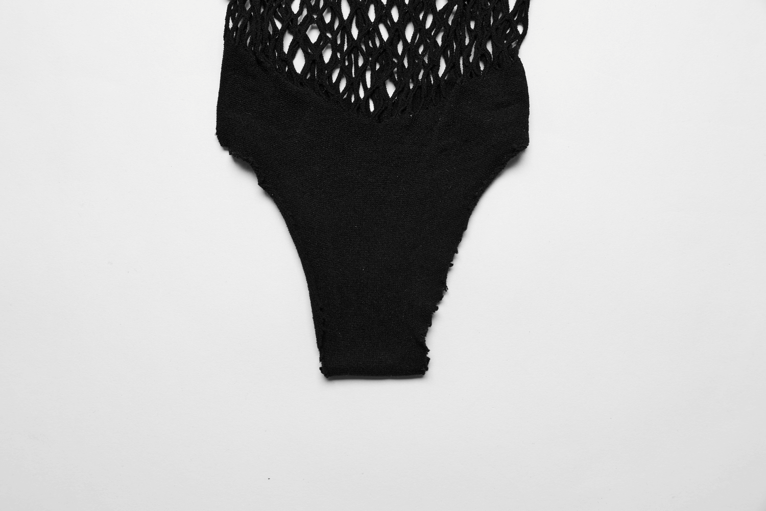 Edgy black fishnet bralette and thong set, showcasing a daring and stylish lingerie design for bold fashionistas.