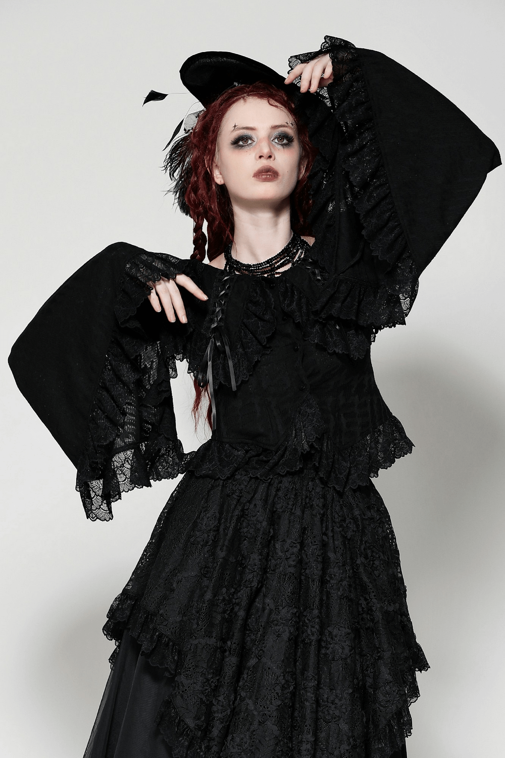 Stylish Goth off-shoulder blouse with bell sleeves and ruffled black lace, perfect for a gothic elegant look.