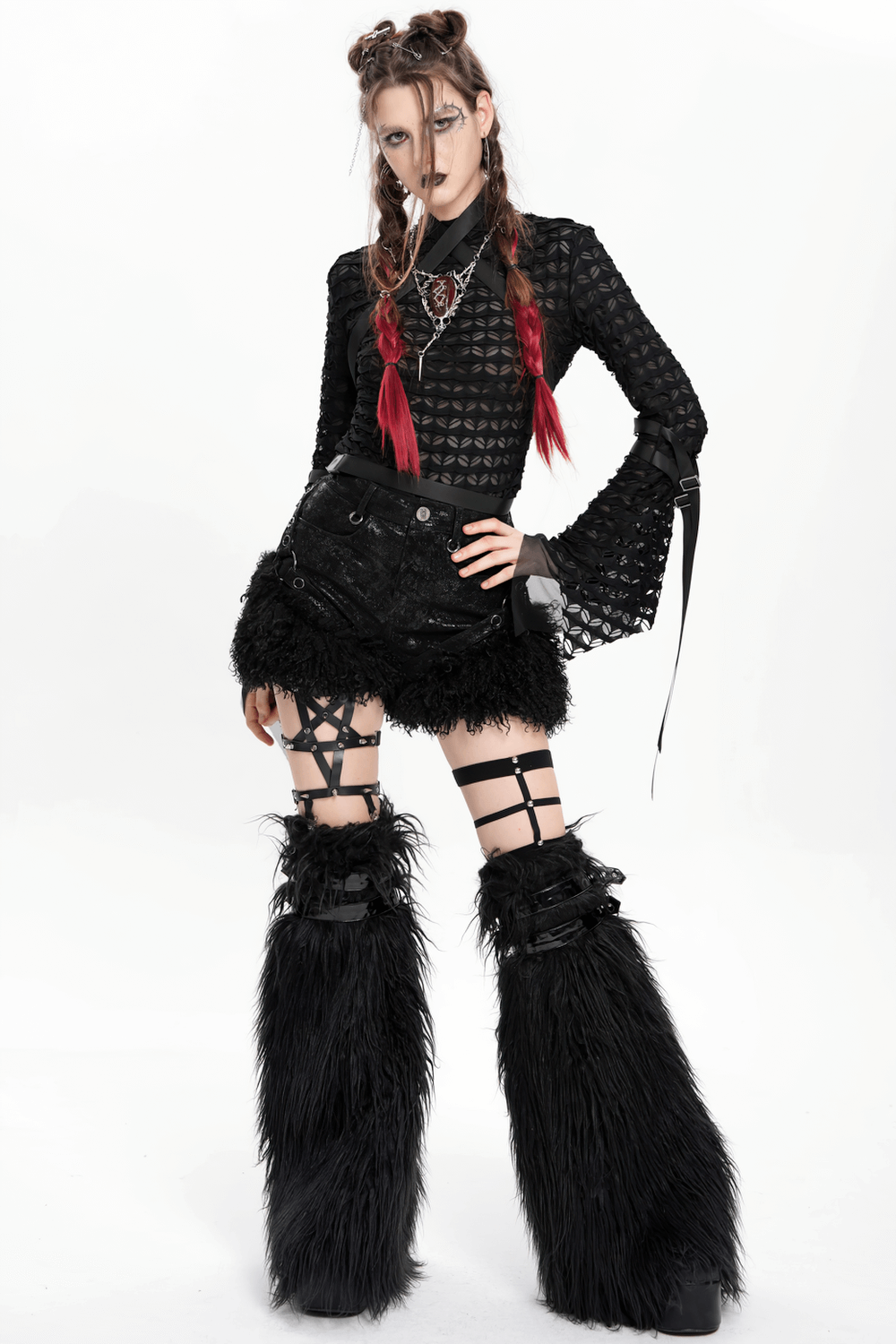Alternative goth fashion with stylish black faux leather shorts and fur trim, paired with strappy accents and edgy accessories.
