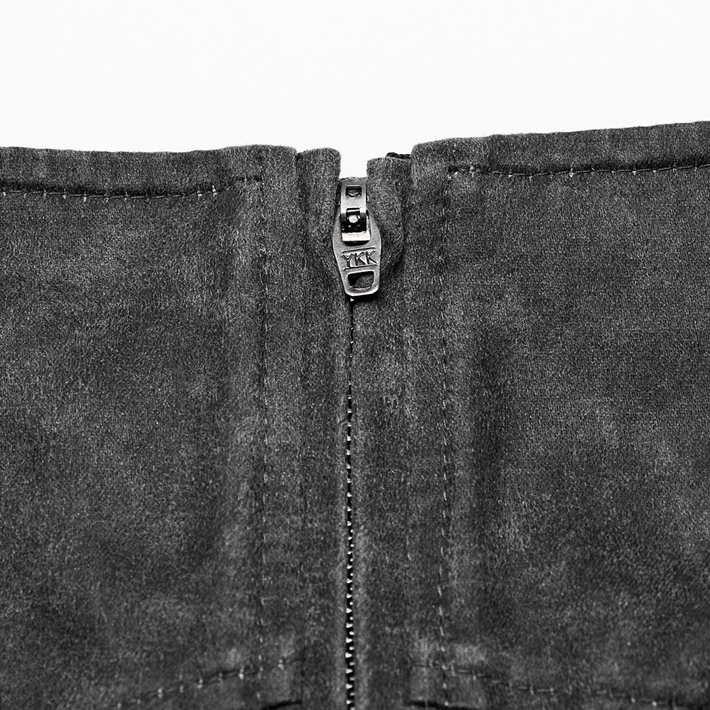 Close-up of the zipper on a stylish gothic denim mini skirt featuring dark fabric and edgy punk design.