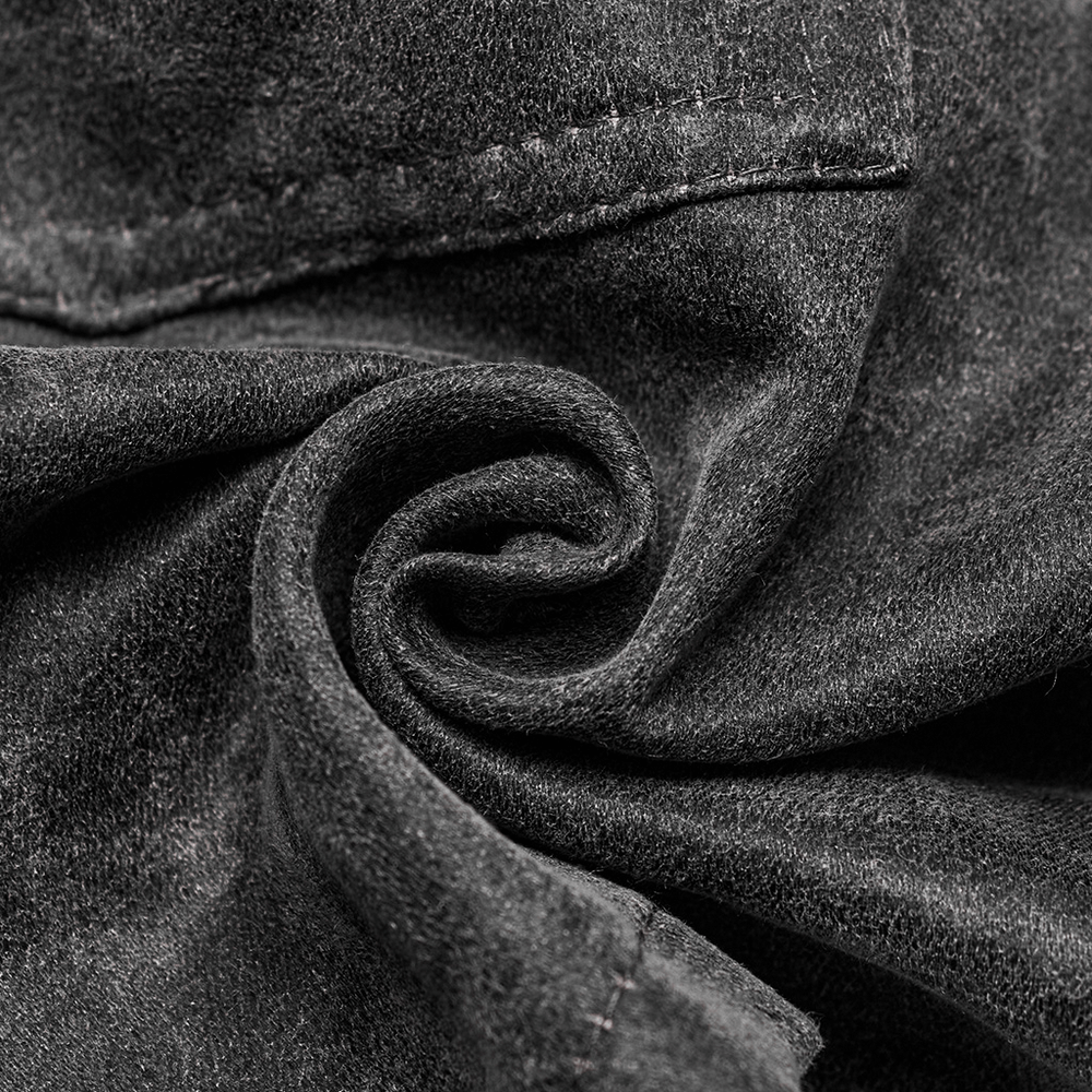 Close-up of dark denim fabric showcasing texture and swirl pattern, perfect for stylish punk skirts.