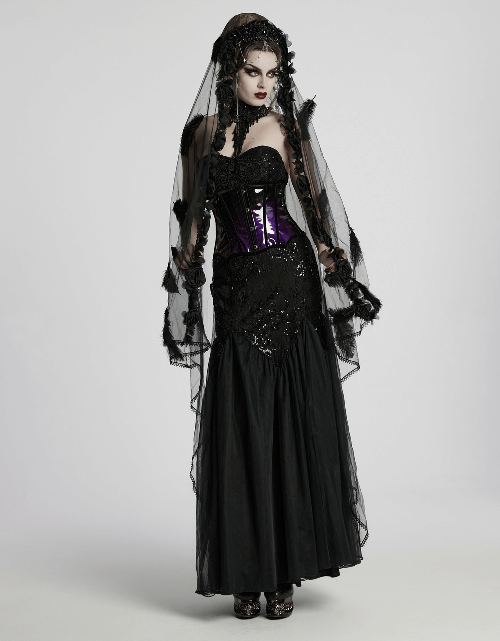 Gothic model in a sleek black gown, showcasing a stylish glossy gradient underbust corset with a dramatic veil.