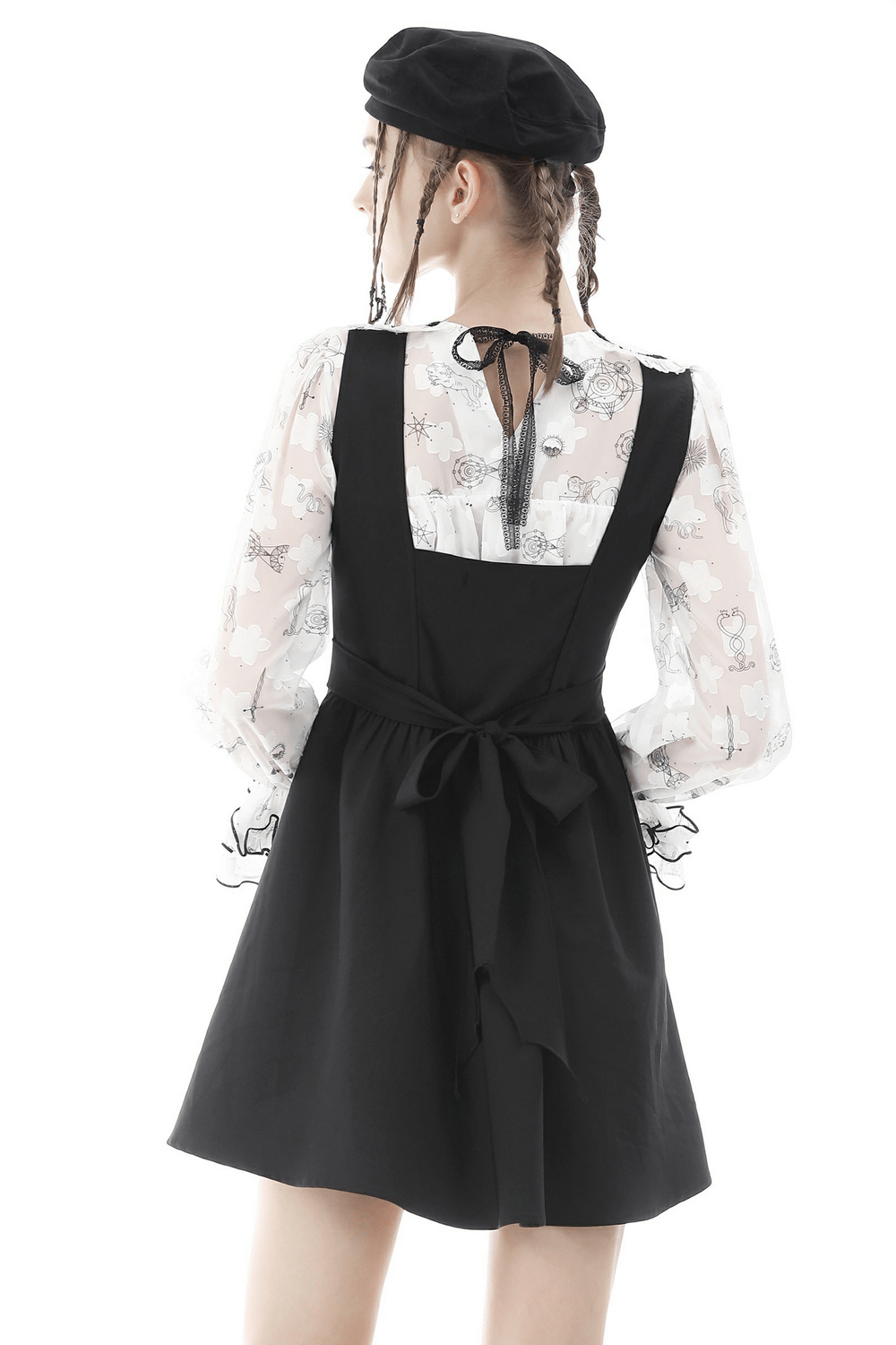 Back view of a stylish black dress with a tied waist and sheer patterned blouse, showcasing a trendy Gothic fashion look.