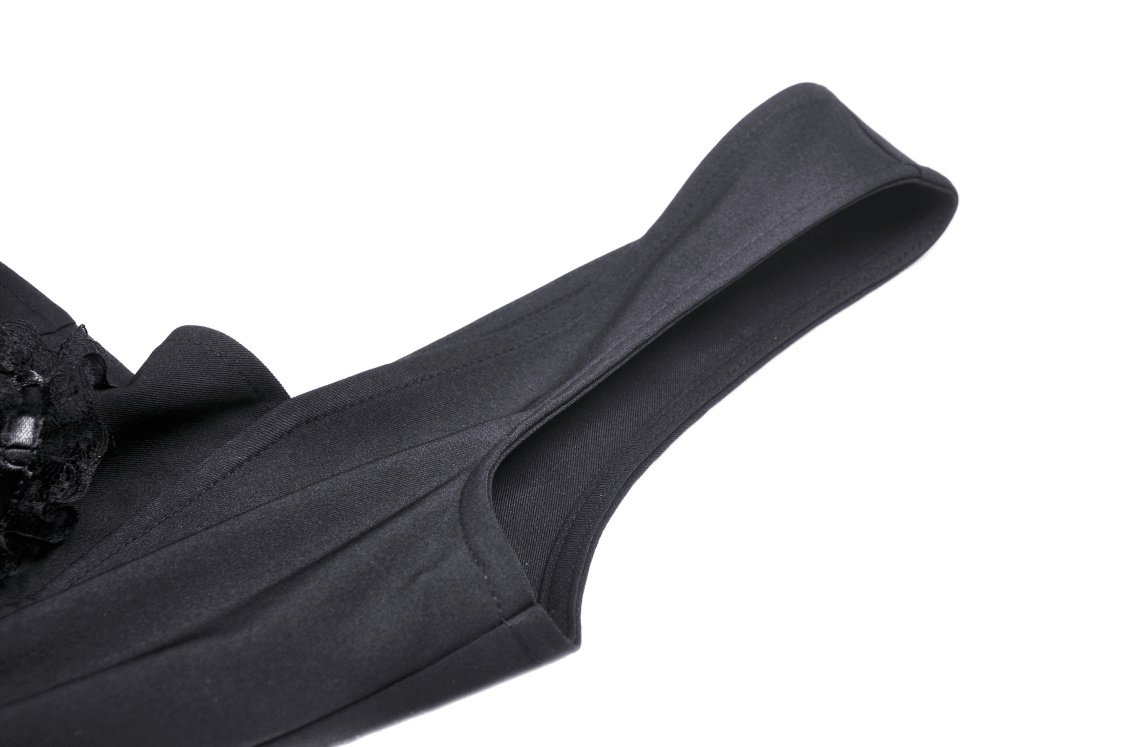 Close-up of the black strap from a stylish Gothic heart-cut lace mini dress.