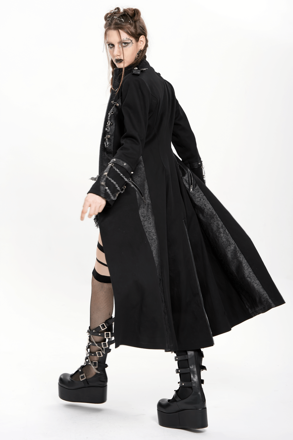 Gothic long coat with chains and high collar, flaunted in a dramatic pose, showcasing dark elegance and steampunk style.