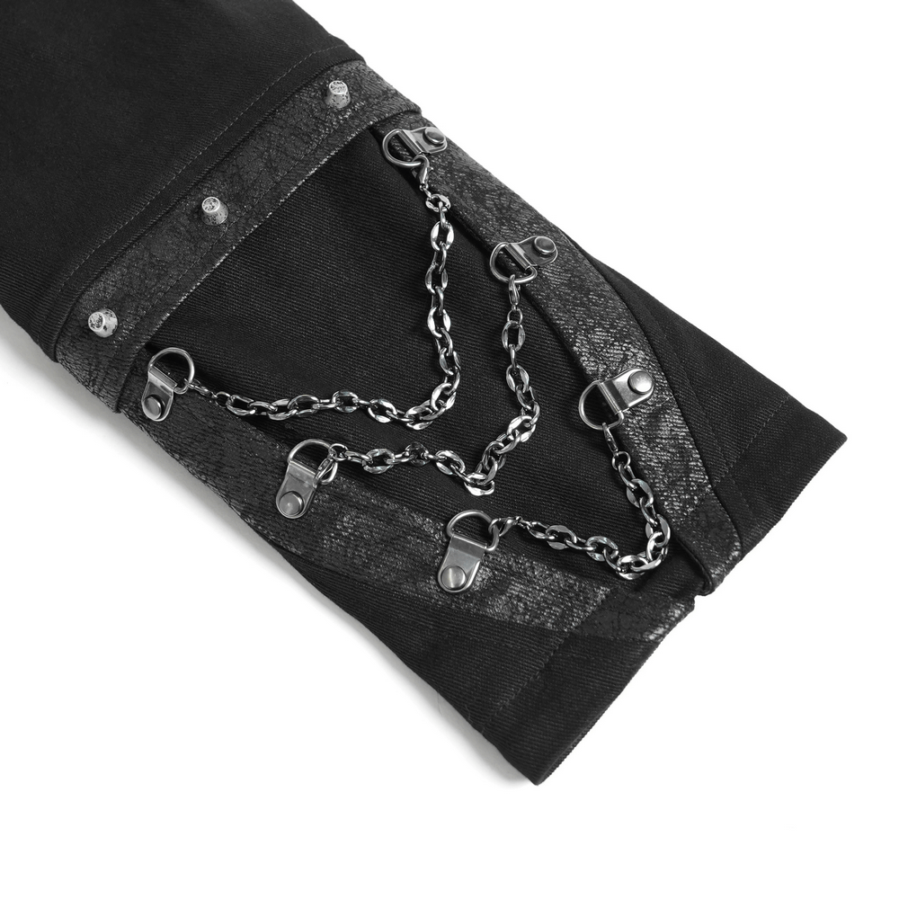 Detail of gothic long coat sleeve featuring decorative chains and embossed cuffs for a stylish steampunk look.