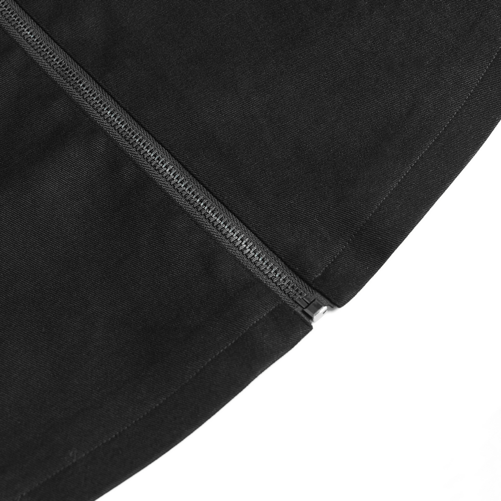 Close-up of a sleek zipper detail on a stylish black gothic long coat.