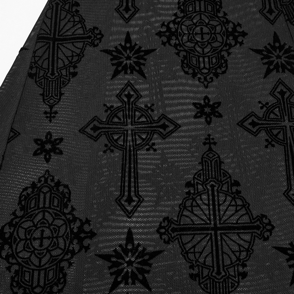 Close-up of stylish gothic black fabric showcasing intricate cross and floral patterns.