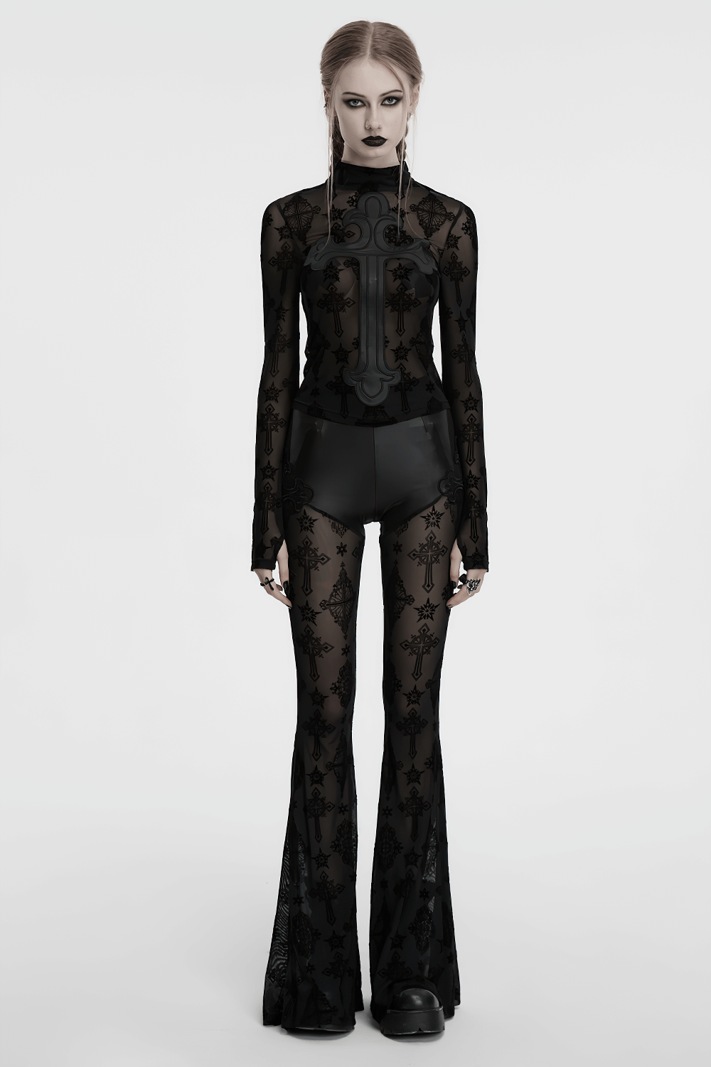 Stylish gothic mesh and faux leather flared pants in black with cross embroidery, showcasing layered design and edgy appeal.