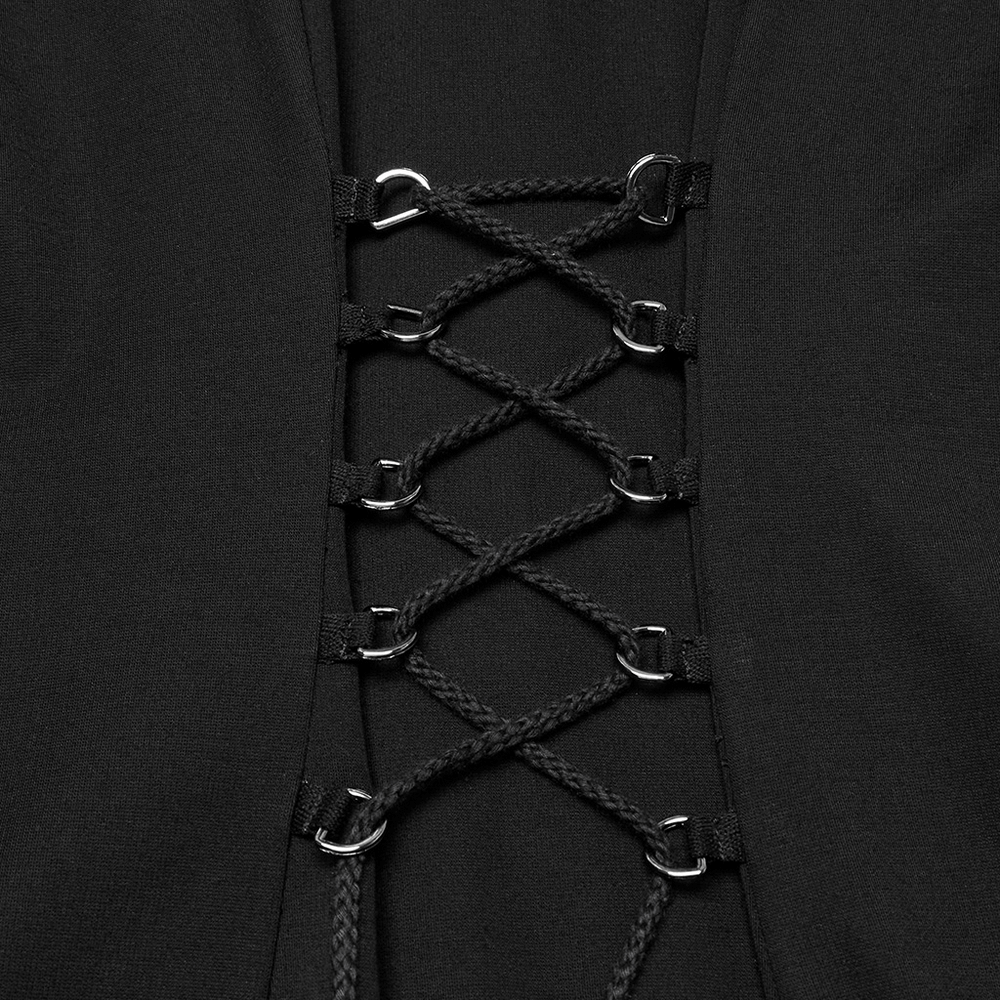 Close-up of stylish gothic dress with metal details and lace-up design, showcasing intricate craftsmanship.