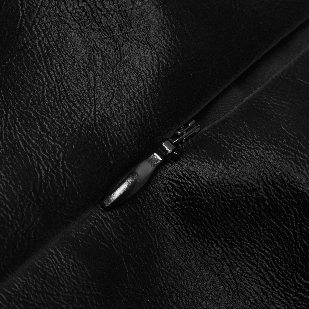 Close-up of stylish black mini skirt zipper, highlighting Gothic punk aesthetic and quality leather texture.