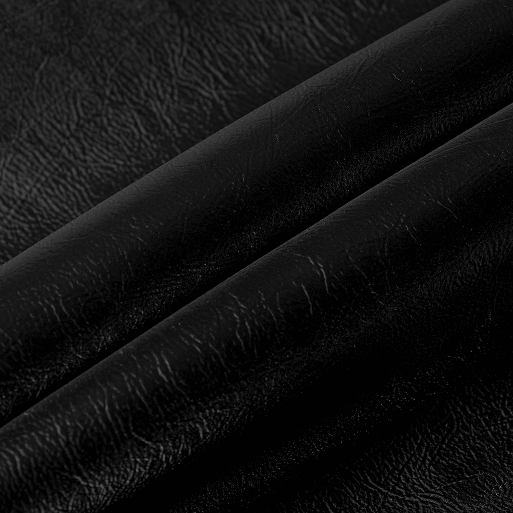 Close-up of black leather fabric, showcasing its textured surface, perfect for a gothic mini skirt.