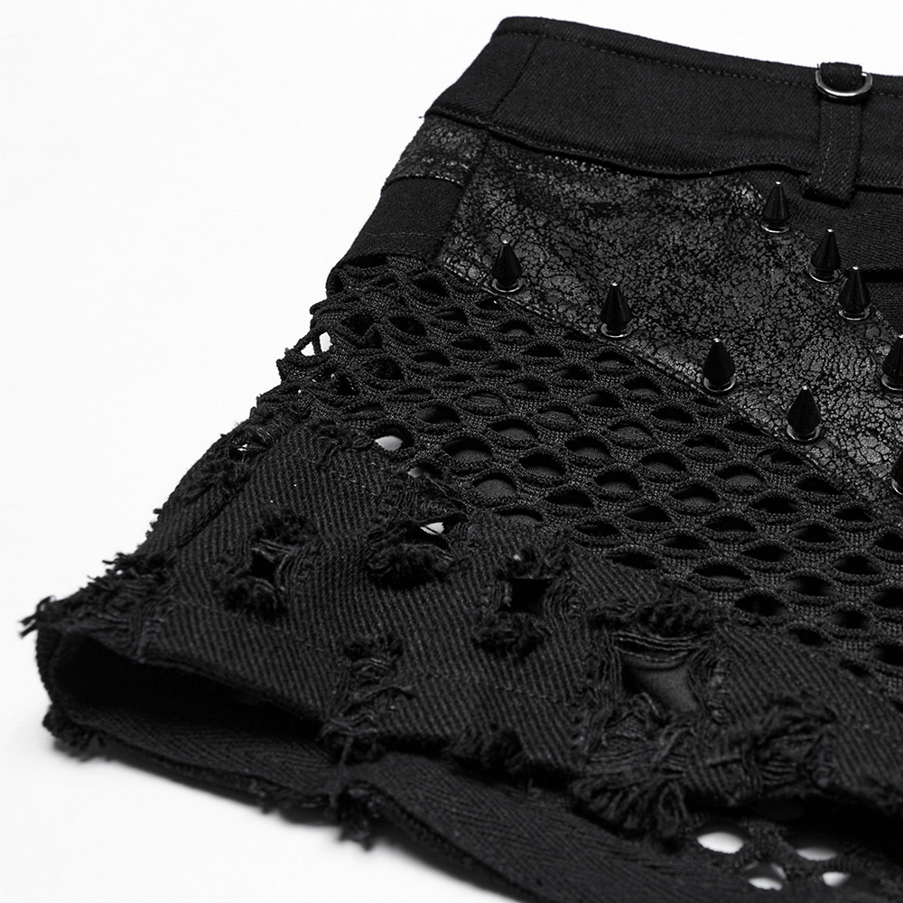 Stylish gothic shorts showcasing intricate designs with spikes and a mesh overlay, perfect for a unique statement look.