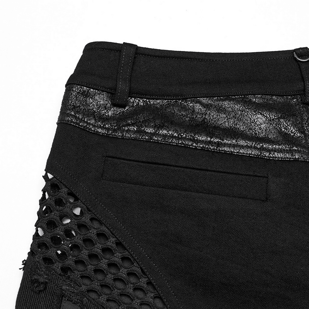 Close-up of stylish gothic shorts featuring a sleek black waistband and unique mesh detailing.