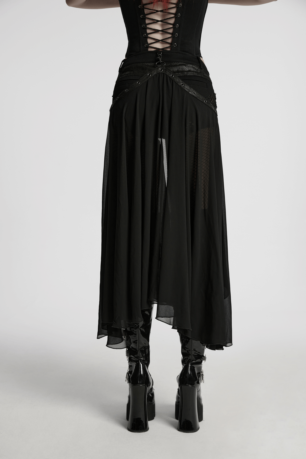 Stylish Gothic shorts with detachable chiffon cape, showcasing bold lace-up design and sleek black materials.