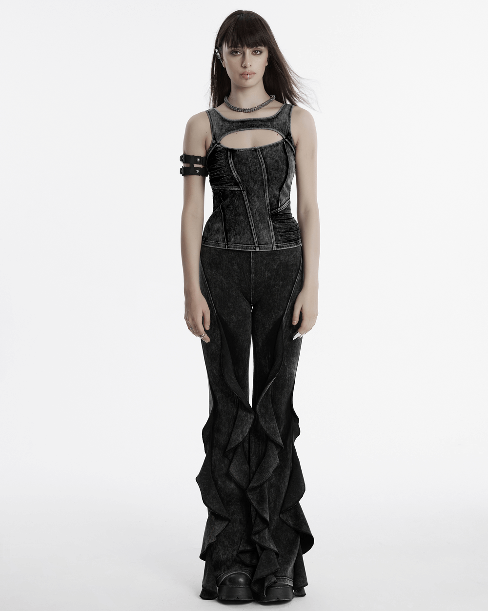 Gothic washed flared pants for women with ruffled edges, styled with a dramatic top for an edgy vintage look.