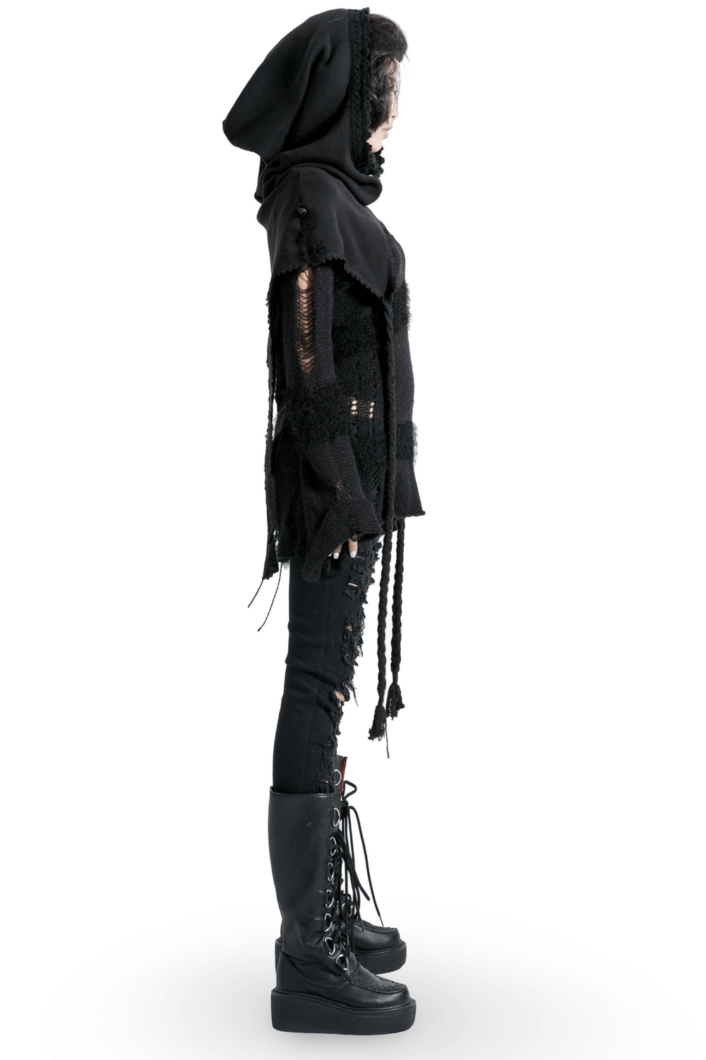 Side view of a stylish gothic black hooded wrap cape paired with edgy black skinny jeans and platform boots.