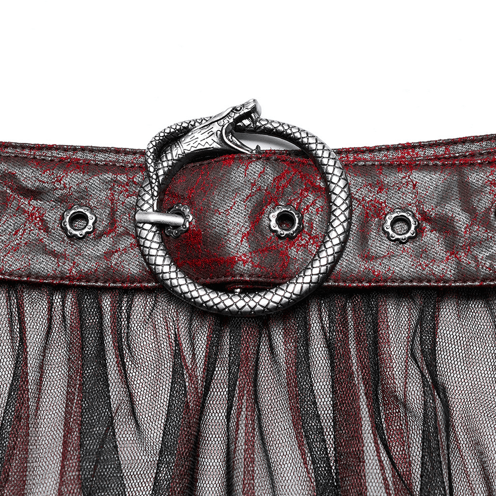 Close-up of punk snake buckle on stylish gradient mesh skirt with asymmetrical design.