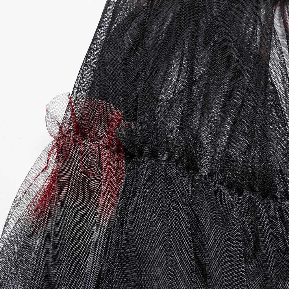 Close-up of the stylish gradient mesh fabric featuring layered black and red tulle for a punk-inspired half skirt.