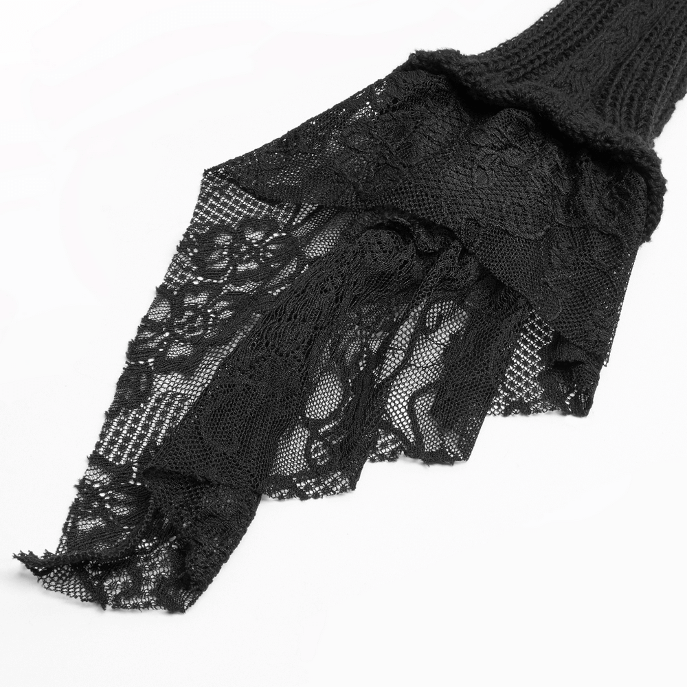 Elegant black lace details cascading from a stylish gothic cardigan sleeve, showcasing intricate floral patterns.